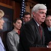 Sen. Christopher Dodd (D-Conn.), flanked by Democratic colleagues after the Senate passed financial reform legislation back in May