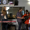 Swedish sister duo First Aid Kit keeps it all in the family with their dad as the sound guy, here he helps tune a guitar.