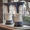 The portico's first exhibit features dozens of Meissen porcelain pieces from the The Arnhold Collection. This is a pair of 'birdcage' vases.