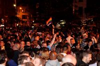 Hundreds gather outside of the Stonewall Inn to celebrate the passage of a same-sex marriage bill.