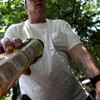 Staying hydrated by filling up water bottle in Union Square Park on a sweltering day in June.