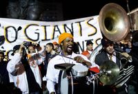Musician Harold Wilson chants as fans celebrate the Giants World Series win at the Civic Center Plaza November 1, 2010 in San Francisco, California.