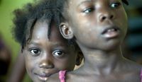 Children wait in line for medical care in Haiti