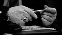 Hands holding a pen