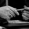 Hands holding a pen