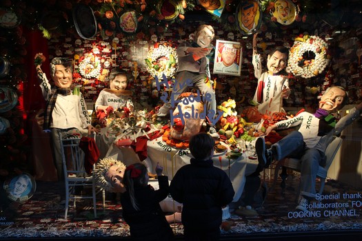 Children check out a Barneys New York window: Mario Batali, Bobby Flay, Emeril Lagasse, Guy Fieri with his signature squeeze bottle and Wolfgang Puck, who is chewing on a giant shrimp, are in the thro