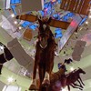 Art as cascade: For his retrospective at the Guggenheim, Italian prankster Maurizio Cattelan strung all his art from the ceiling.