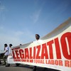 Protestors participate in a 'March For America' demonstration calling for immigration reform near the Washington Monument March 21, 2010 in Washington, DC.