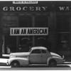 Oakland, Calif., Mar. 1942. A large sign reading 'I am an American' placed in the window of a store, at 13th and Franklin streets, on December 8, the day after Pearl Harbor. 