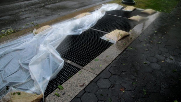 Irene's winds had blown off plastic held down by sandbags meant to keep water out of subway grates in Crown Heights, Brooklyn.