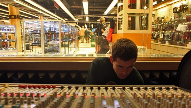 Jermy Gastrock, 22, from Austin, TX playing with the nearly $200,000 mixing board at B&H. This was his second stop in the city, after doing his work, he raced over here. 