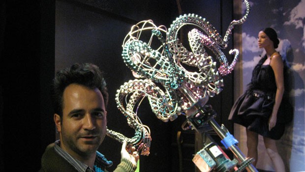 Saks Director of Windows Julio Gómez shows off an octopus as the holiday windows are being set up. Its windows will be unveiled on Monday.