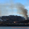 This picture taken on November 23, 2010 by a South Korean tourist shows huge plumes of smoke rising from Yeonpyeong island in the disputed waters of the Yellow Sea on November 23, 2010.