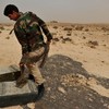 A Libyan rebel fighter prepares an ammunition belt on the outskirts of Ras Lanuf on March 4, 2011 before heading with a group of comrades into the oil port town to battle Moammar Gadhafi loyalists.