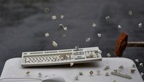 Hammer smashing computer keyboard
