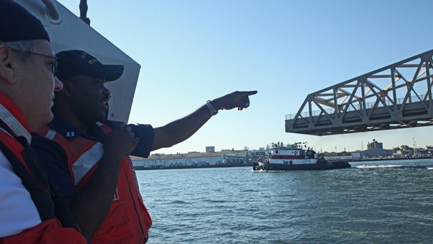 The U.S. Coast Guard Lieutenant Will George points out the unique aspects of the barge