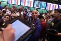 Traders on the floor of the New York Mercantile Exchange on August 4, 2010 in New York City