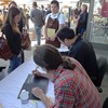 Peter Meehan and David Chang sign copies of their book.