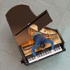 Pianist Amir Khosrowpour performs as part of <em>Stop, Repair, Prepare: Variations on “Ode to Joy” for a Prepared Piano</em> by Jennifer Allora and Guillermo Calzadilla.