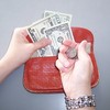 hand, wallet and lots of money