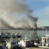 This picture taken on November 23, 2010 by a South Korean tourist shows huge plumes of smoke rising from Yeonpyeong island in the disputed waters of the Yellow Sea on November 23, 2010.