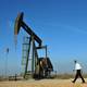 Barack Obama walks past an oil rig to a stage to speaks at an oil and gas production fields on federal lands March 21, 2012 near Maljamar, NM.