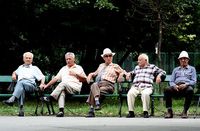 A group of elderly Romanian men relax.
