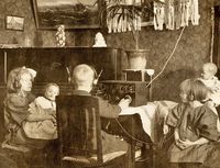 children listening to an old radio