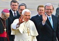 Pope Benedict XVI greets a crowd while on a visit to Australia. By his side is Prime Minister of Australia Kevin Rudd.