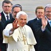 Pope Benedict XVI greets a crowd while on a visit to Australia. By his side is Prime Minister of Australia Kevin Rudd.