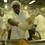 Inmate Nathaniel Harris seasons a turkey before putting it in the oven.