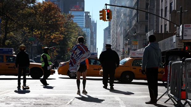 Runners wrapped in emergency blankets leaving Central Park
