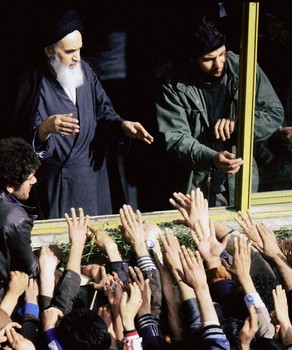 The Islamic Revolution's founder Ayatollah Ruhollah Khomeini (L) greeted 02 Februry 1979 in Tehran by his supporters during his return to Iran after 15 years in exile in Iraq and France.