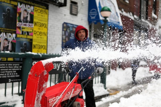 Snow blower making it's way down street in SoHo