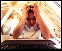 stressed out man at computer