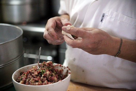 Stuffing a <em>momo</em>.