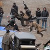 Stuntmen train on the set prior to the shooting of a scene of the 'Sherlock Holmes 2' movie, in front of the cathedral of the French eastern city of Strabourg, on February 3, 2011