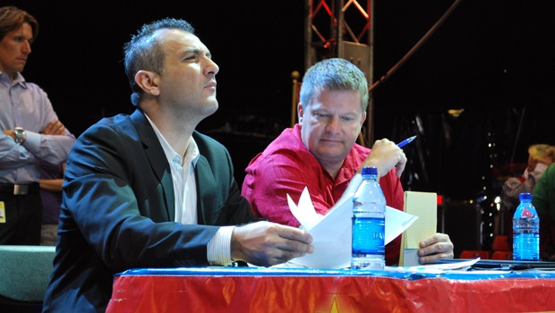 Talent Scouts Vinicio Murillo (left) and David Kiser watch the aspiring clowns. 