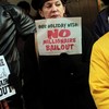 People attend a rally outside of the office of Sen. Charles Schumer (D-NY) to protest an extension of tax breaks for the wealthiest two percent of Americans on December 2, 2010 in New York City.