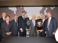 District Attorney Cy Vance, former District Attorney Robert Morgenthau and members of the American Joint Jewish Distribution Committee with the Torah scrolls
