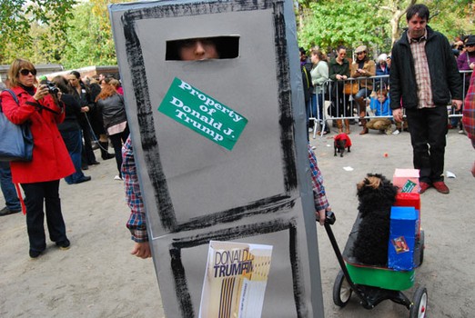 In this elaborate costume, the dog was Donald Trump (see its light-colored wig) and his owner was the Trump Towers.
