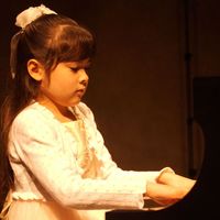 young Umi Garrett at the piano