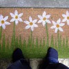 welcome mat with daisies