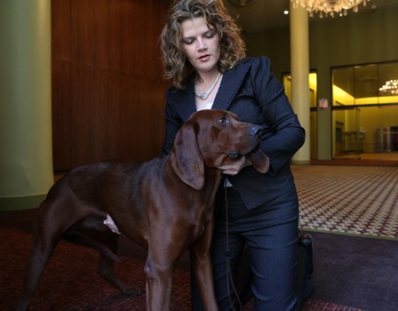 Rufus, a redbone coonhound, with his owner, Christine Smith.