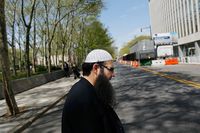 Ahmad Afzali, an imam from Queens walks to Brooklyn federal court for tipping off confessed terror plotter Najibullah Zazi. 
