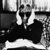 Claude Rains, as the Invisible Man in the 1933 film, seemingly with a song stuck in his head.