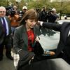 New York Times reporter Judith Miller (C) leaves U.S. District Court trailed by her attorney, Bob Bennett (L), following a grand jury appearance October 12, 2005 in Washington, DC.