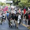White nationalist demonstrators walk through town after their rally was declared illegal near Lee Park in Charlottesville, Va.  August 12, 2017.