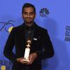 Aziz Ansari poses in the press room with the award for best performance by an actor in a television series - musical or comedy at the 75th annual Golden Globe Awards.