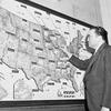 FBI director J. Edgar Hoover traces movements of his special agents in the U.S. and outlying possessions on May 3, 1954.